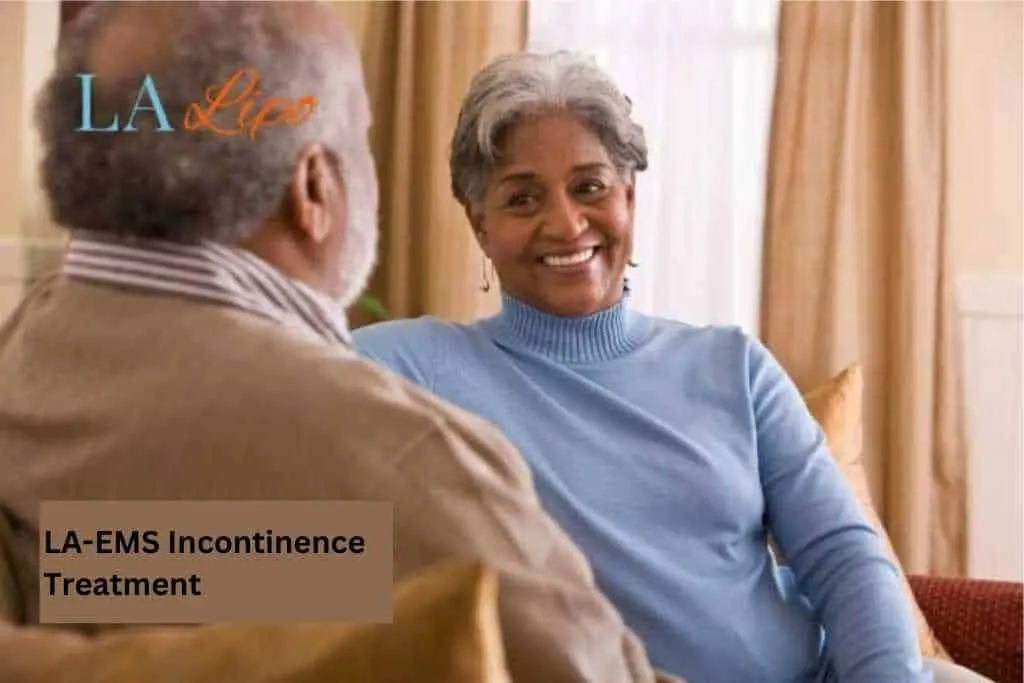 Couple sat smiling at each other - LA-EMS treatment Temple Mills
