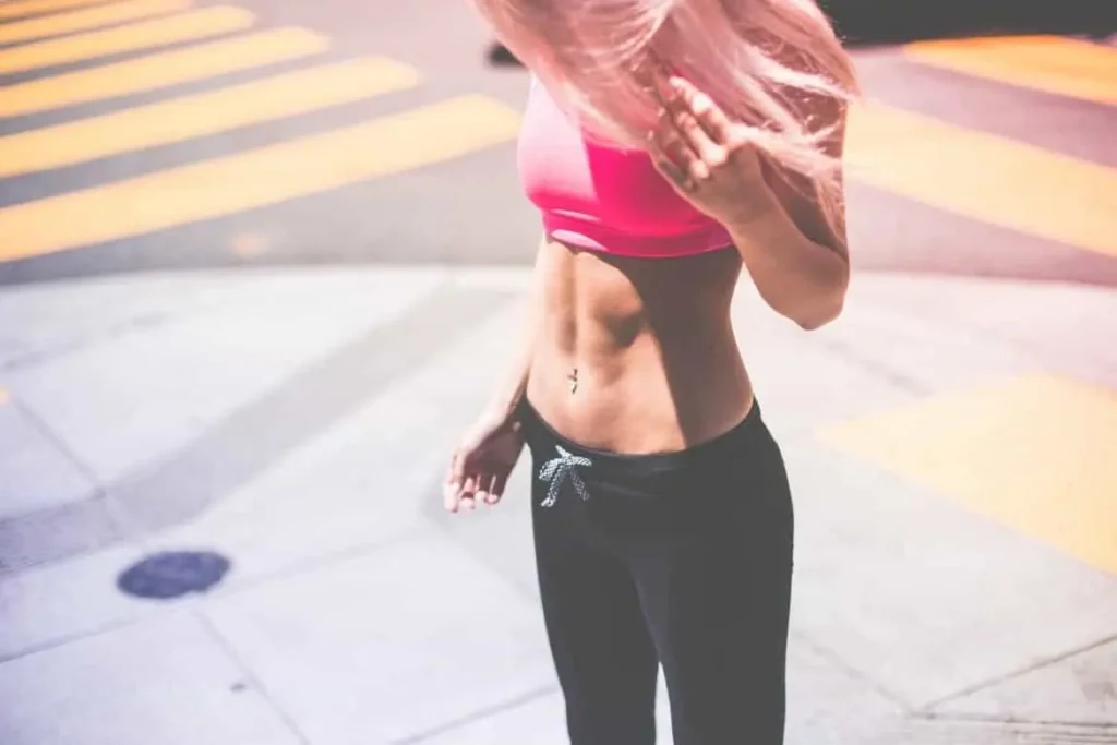 Woman with toned stomach after LA-EMS Body Sculpting Treatment Temple Mills