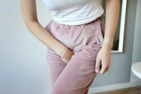woman running for the toilet because of urinary incontinence Temple Mills